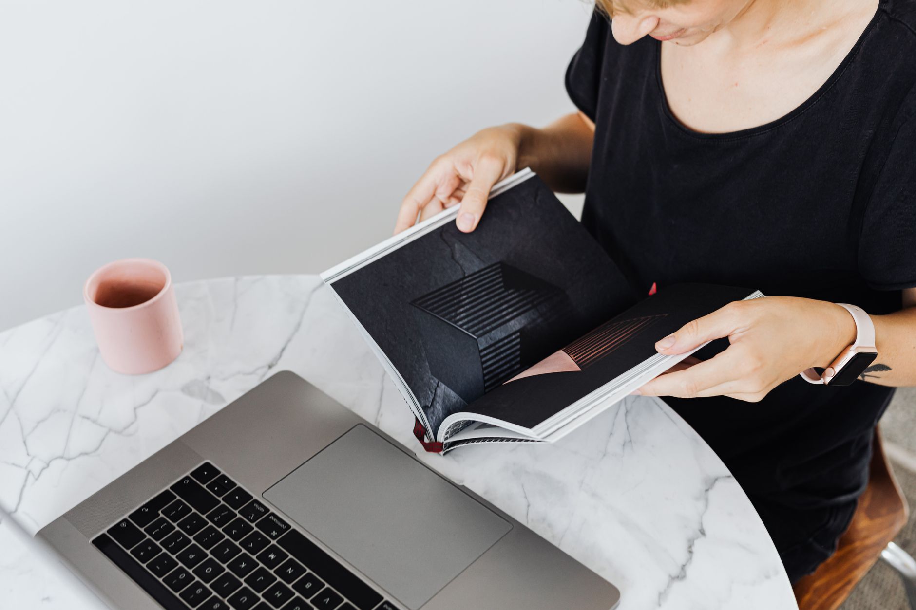 designer laying out eBook pages in Canva on a laptop screen