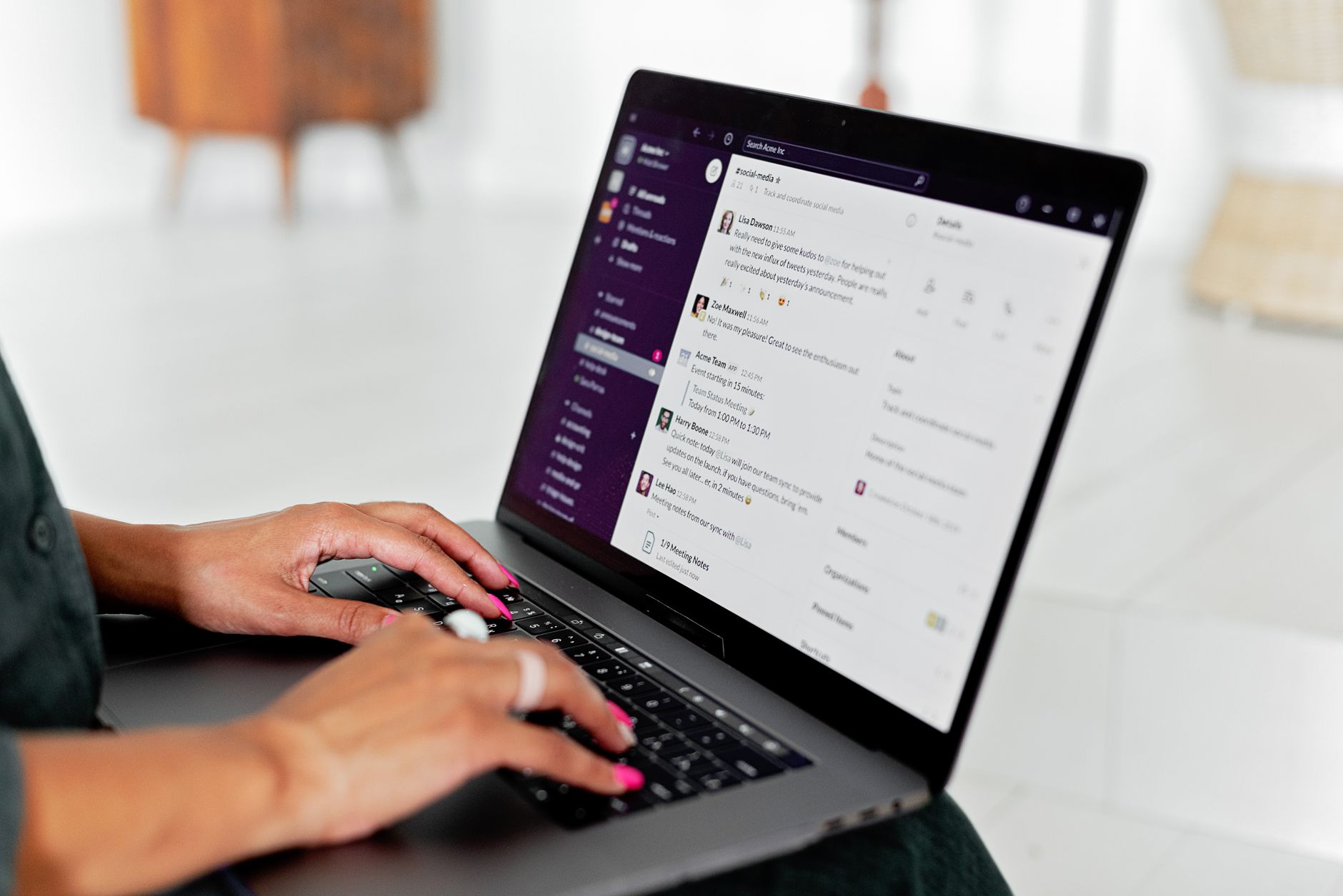a person typing a ChatGPT prompt on a laptop with a chat interface open on screen