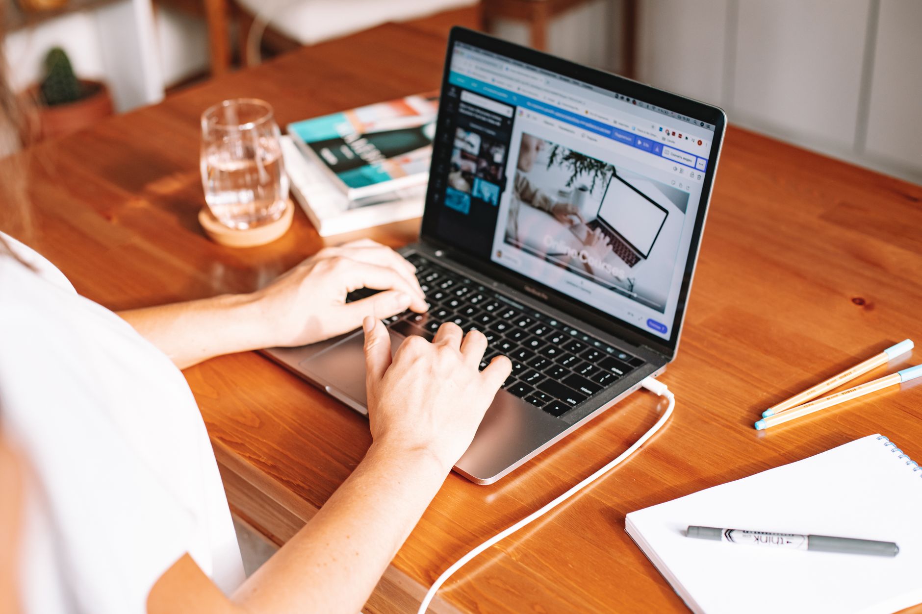 a person writing a product listing on a laptop with an online marketplace dashboard open
