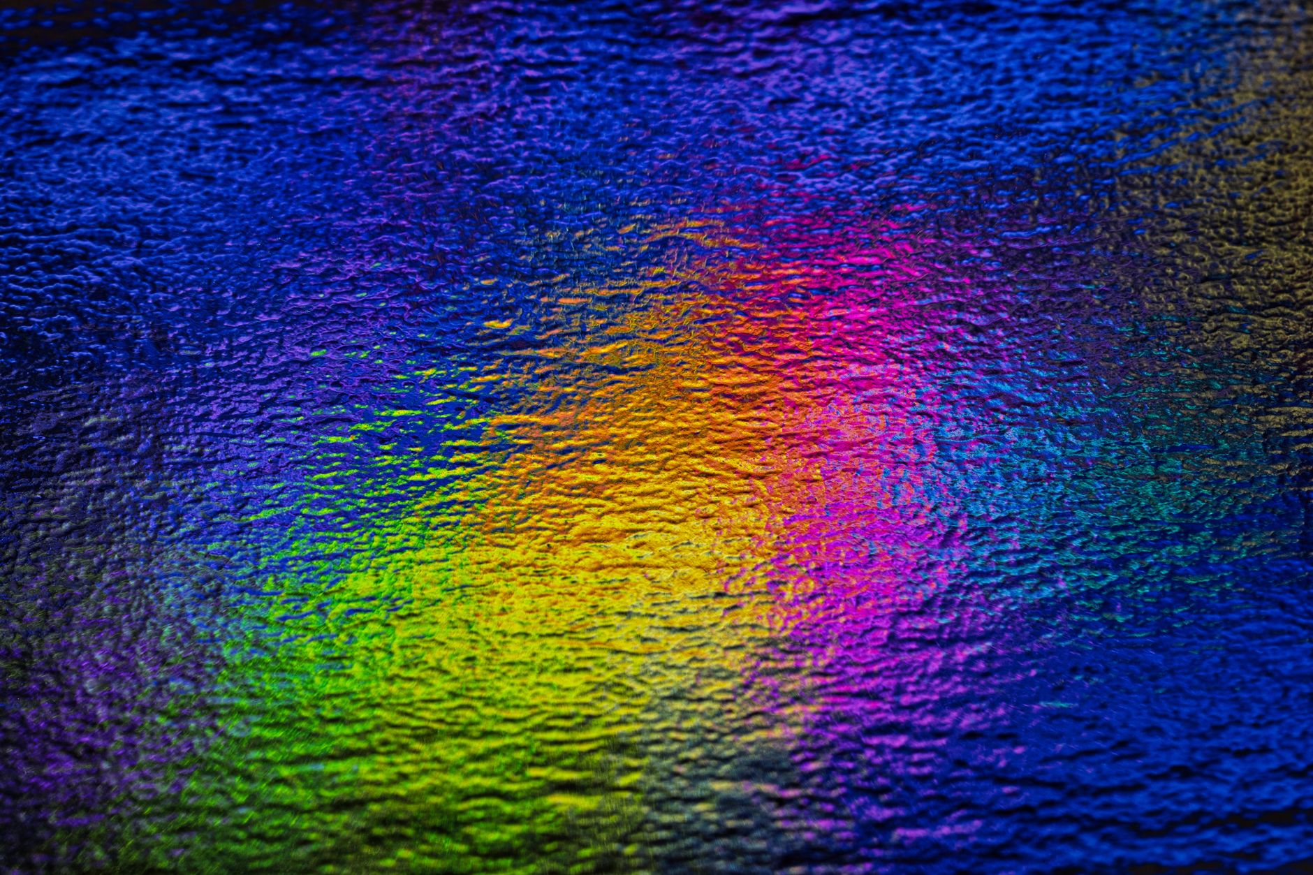 a close-up of a printed abstract art piece showing fine texture and vibrant colors