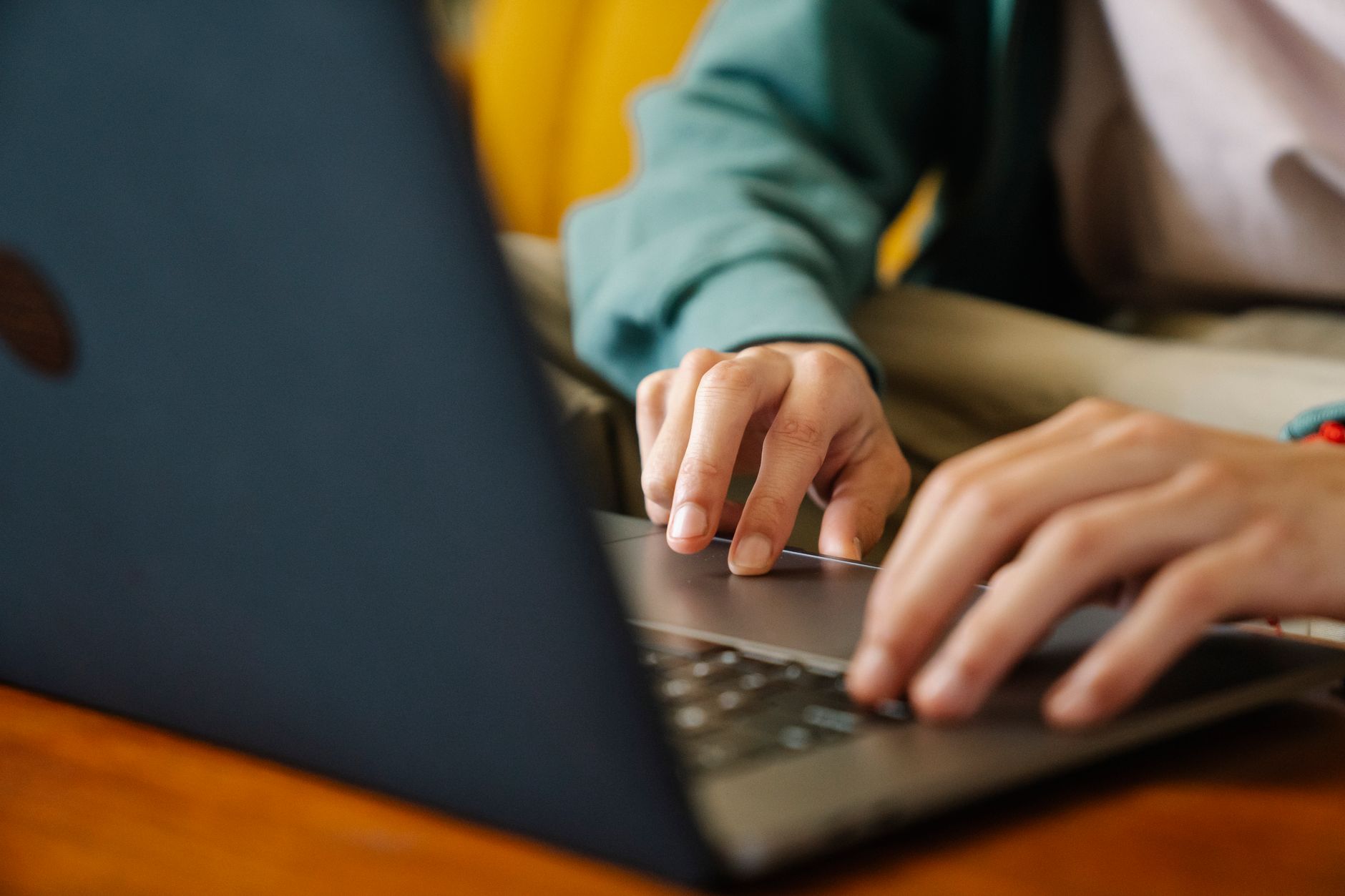 a person building a Notion workspace on a laptop showing a database view